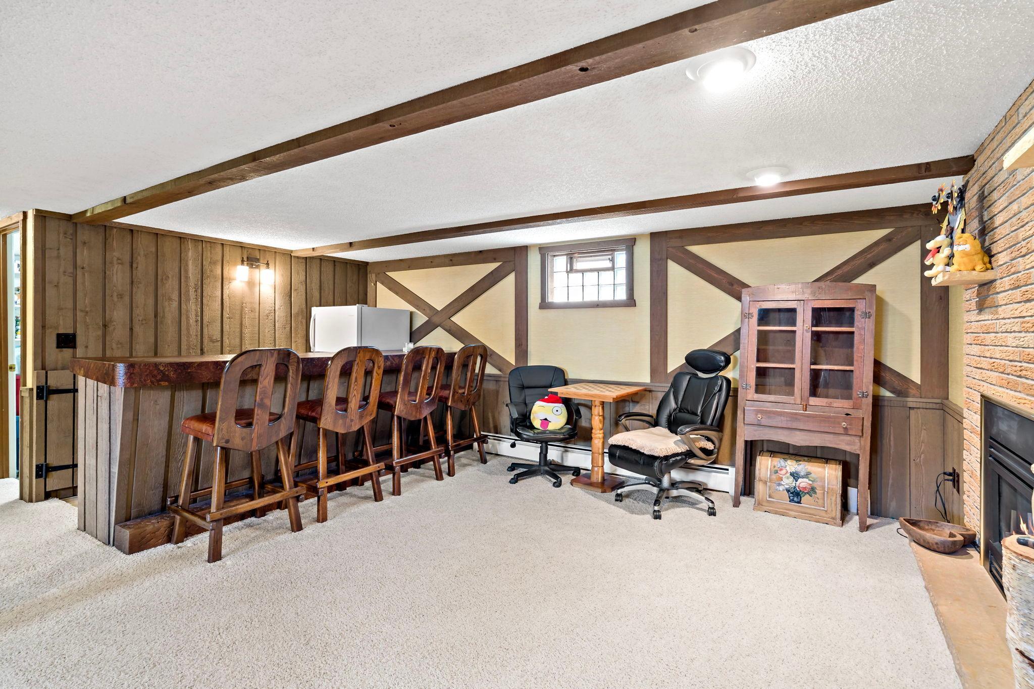 Awesome vintage bar! Chairs and fridge stays with home!
