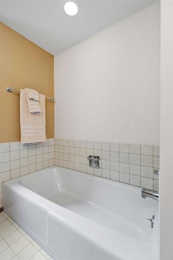 1. The ensuite bath features a separate tub and shower, plus a double-sink vanity.