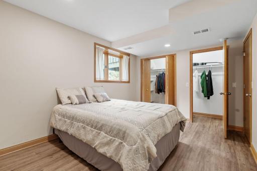 Two closets provide generous storage in the lower-level bedroom, keeping clothing and everyday essentials neatly organized.