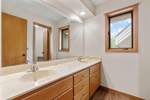 1. The ensuite bath features a separate tub and shower, plus a double-sink vanity.