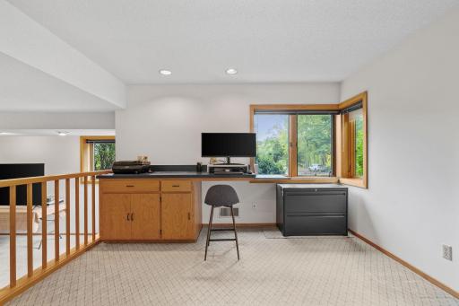 Office windows welcome sunlight, creating a bright setting for focused work.