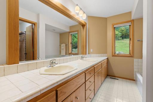 A full bathroom conveniently serves the three bedrooms on this level.