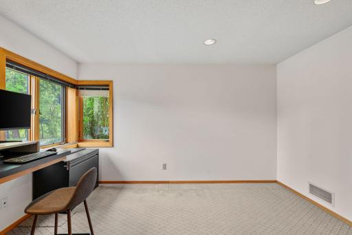 A dedicated office keeps work and paperwork tucked away from the main gathering areas.