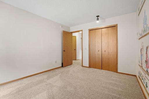 Spacious secondary bedrooms provide room for furnishings, a desk, and personal touches.
