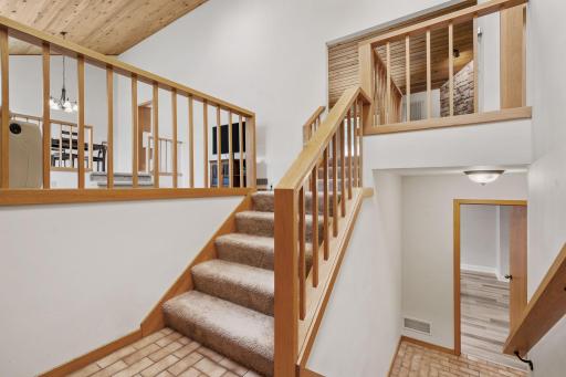 A vaulted entry welcomes you with an open feel and easy access to the homeâs main living areas and lower-level gathering spaces.