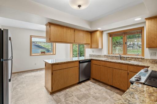 Granite countertops provide ample space for meal preparation and serving.