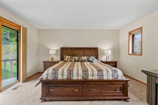The spacious primary suite offers plenty of room for a king-size bed and additional furnishings.
