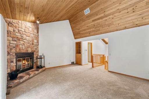 A soaring 13-foot tongue-and-groove wood ceiling gives the family room its own distinctive character.