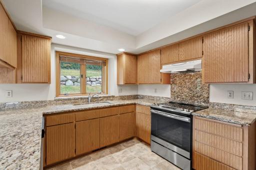 Custom cabinetry brings timeless character and abundant storage to the kitchen.