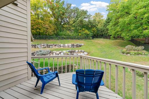 Private deck access creates a peaceful place to step outside and enjoy the wooded surroundings.