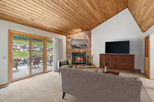 Sliding glass doors lead directly to the expansive deck, extending your gathering space outdoors.