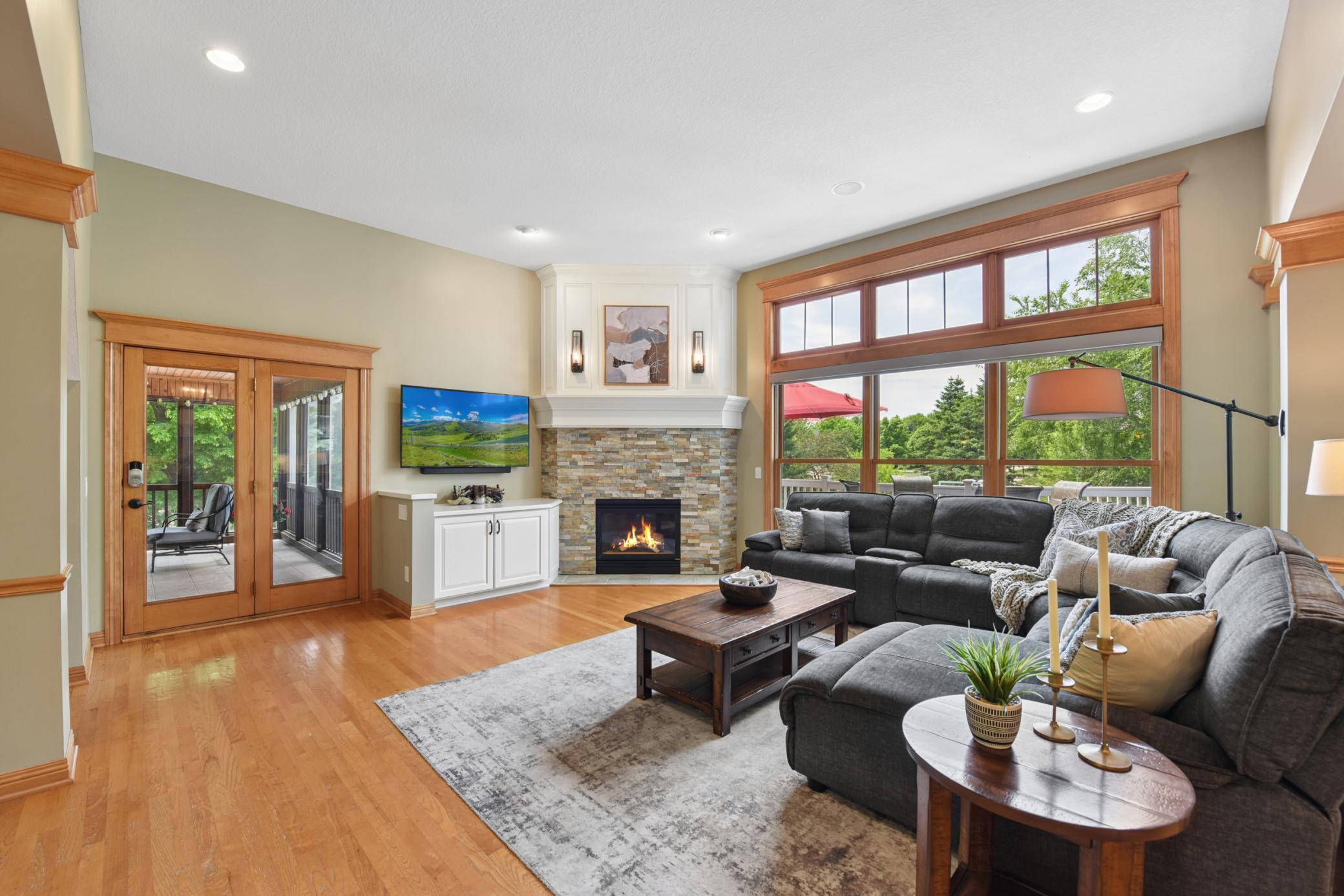 Floor to ceiling windows and walks out to screened porch
