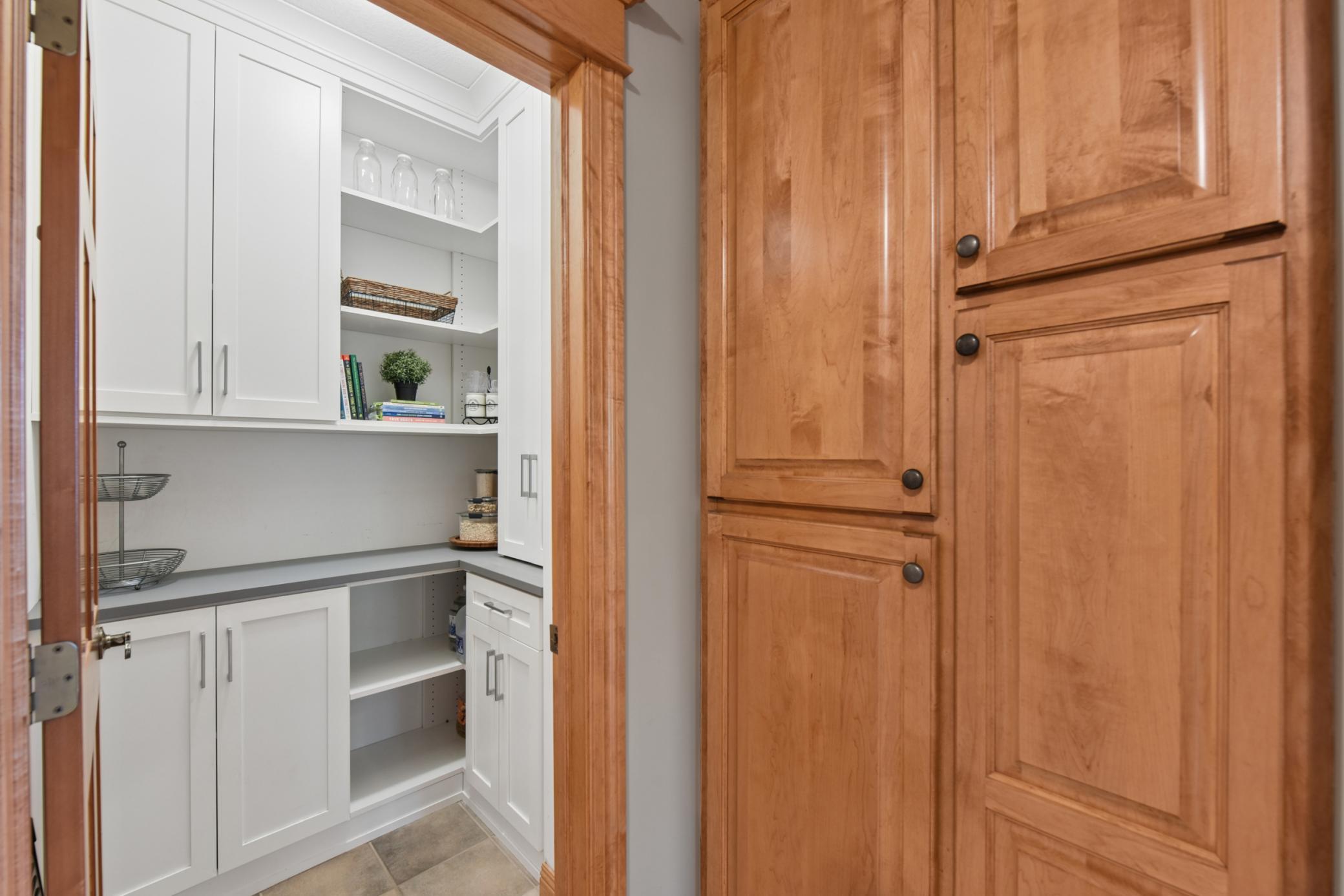 Great storage throughout the home! California closet system in the pantry