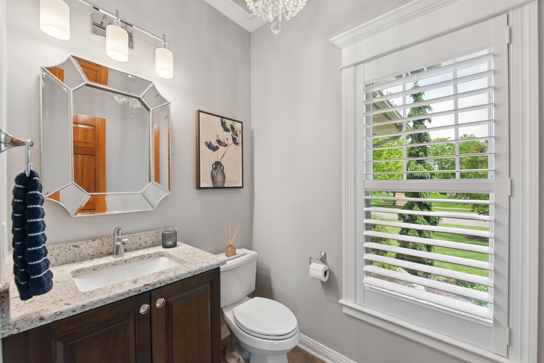 Updated powder bathroom with plantation shutter