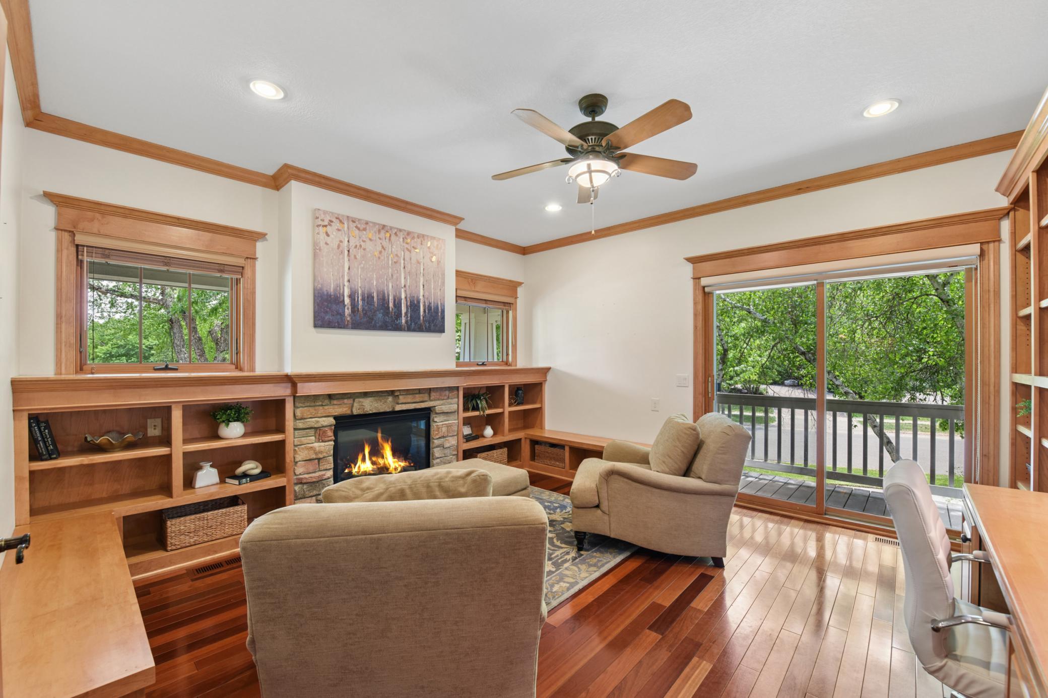 This is a home office you have been dreaming of. Built ins, gas fireplace and walk out to the patio