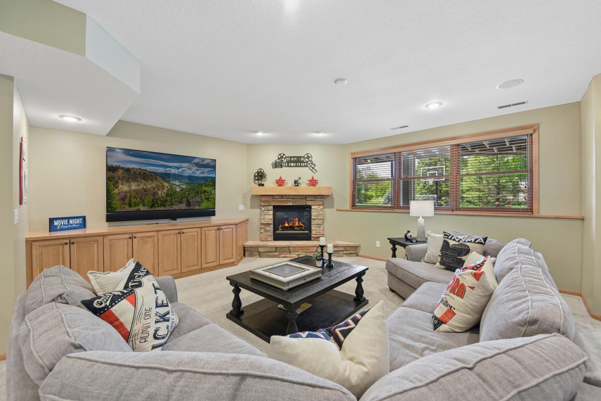 Lower level family room with ceiling speaker system