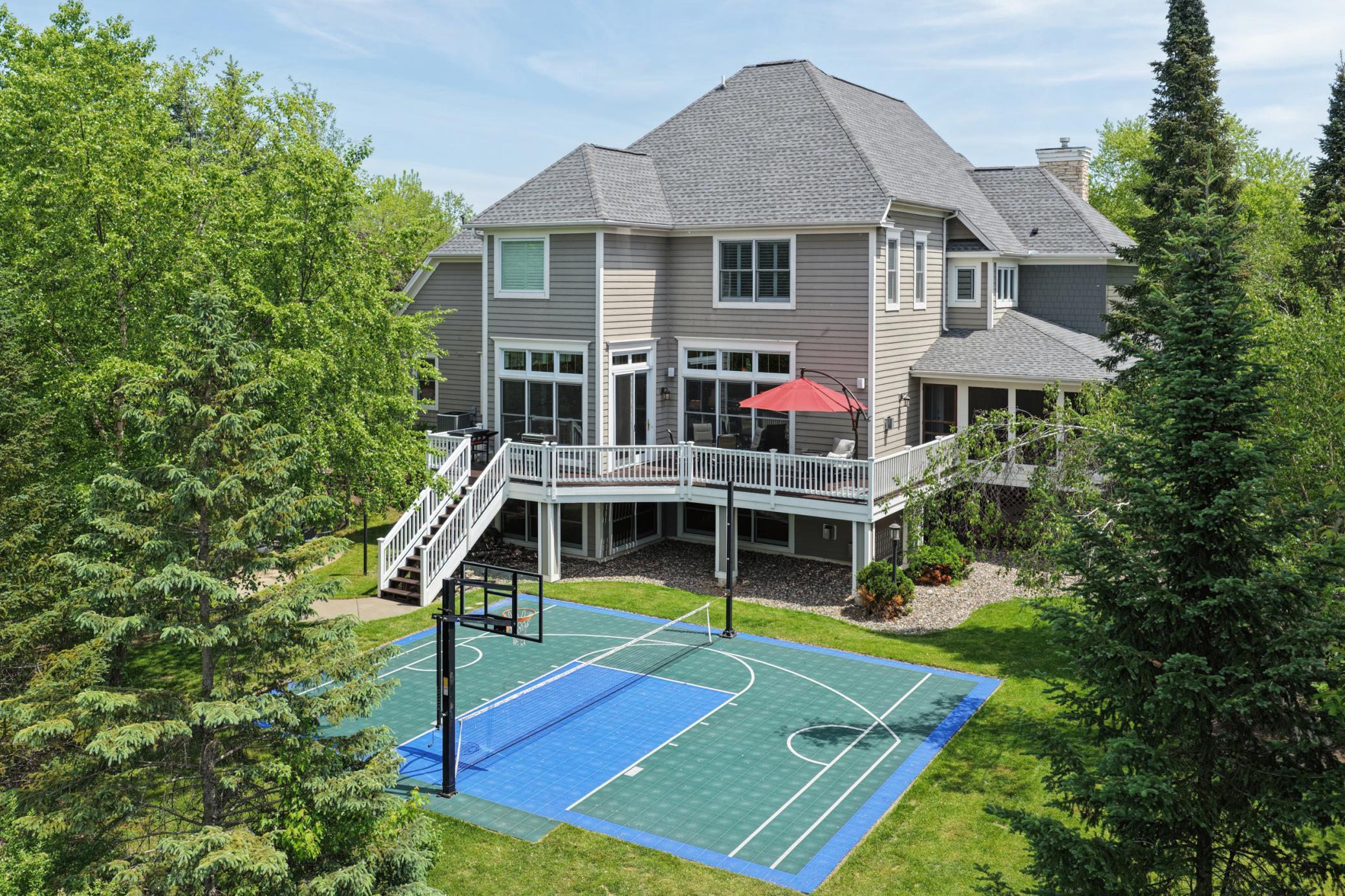 Spacious backyard with sport court