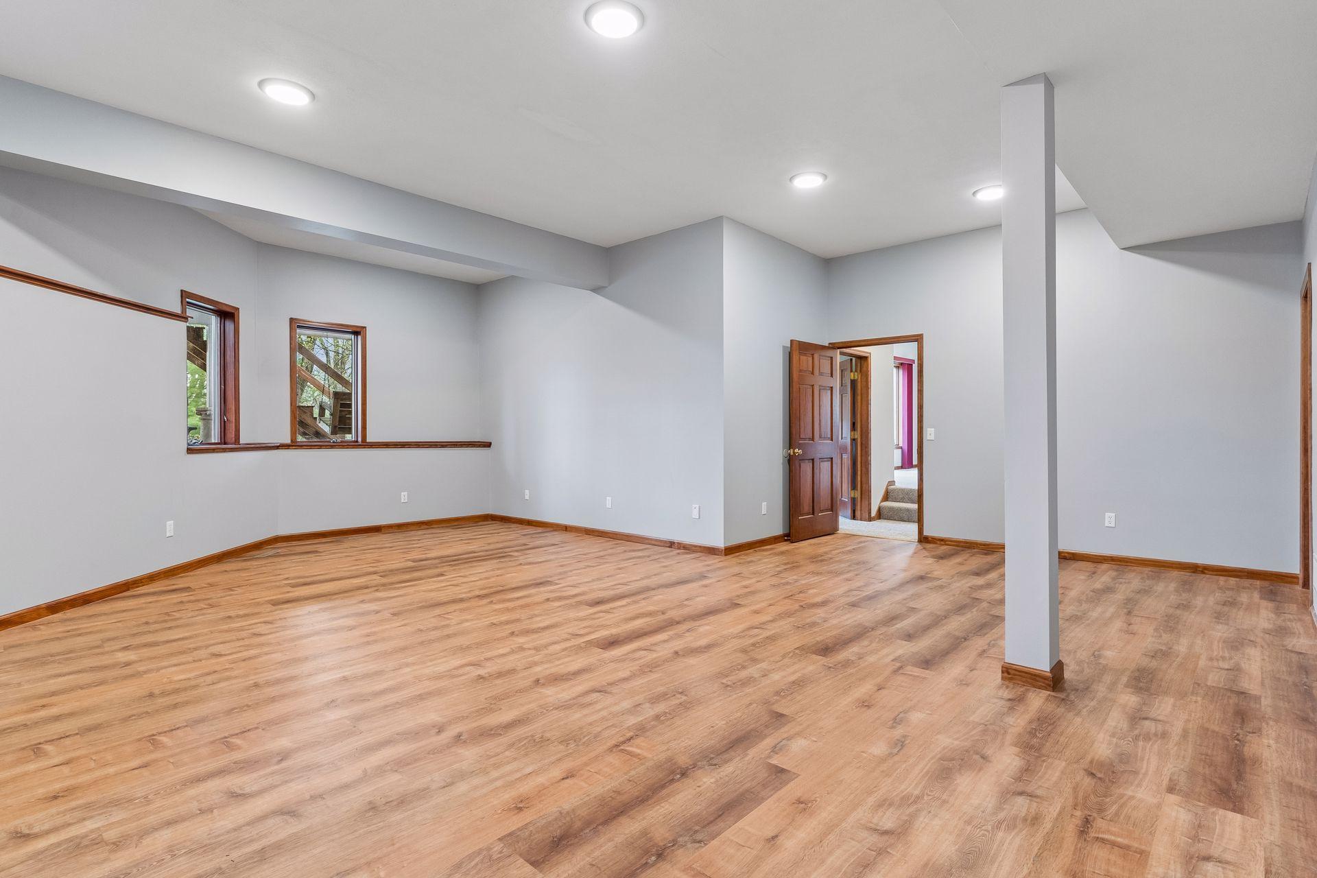 A second view of the lower level bonus room/workshop that could be used for multiple uses; a mother-in-law apartment, home gym, studio, daycare or in-home business.