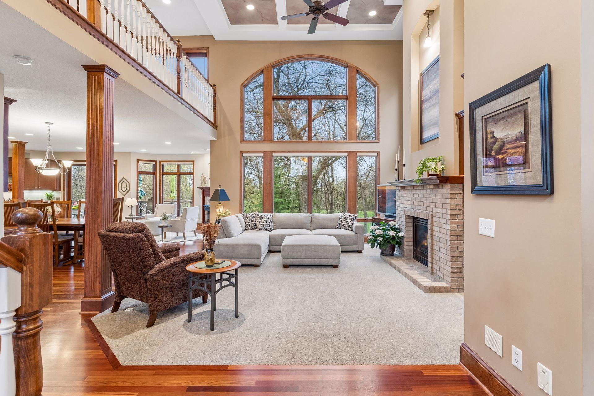 Breathtaking two story great room with a custom ceiling finish, gas burning brick fireplace and built-in entertainment center.