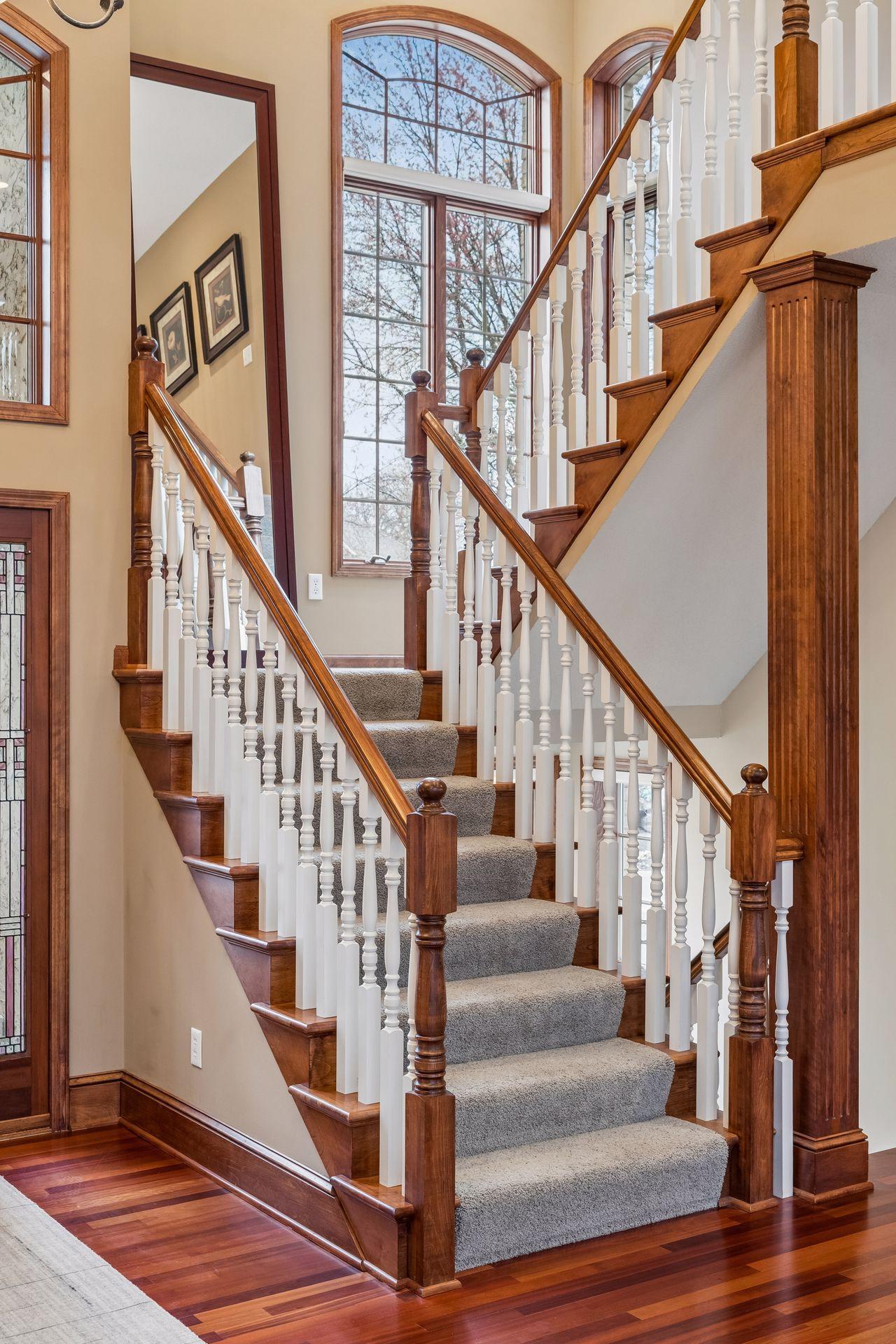 Pay attention to the fine details; fluted columns, finished stair treads, open spindles and grand windows in the staircase.