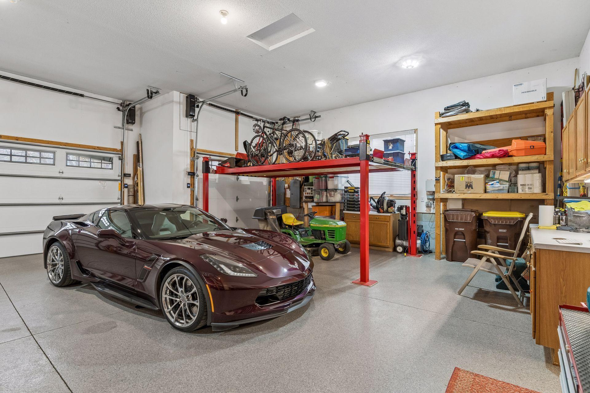 The 13' garage ceiling height allows for an electronic hydraulic hoist for additional storage which is negotiable with the sale of this home.