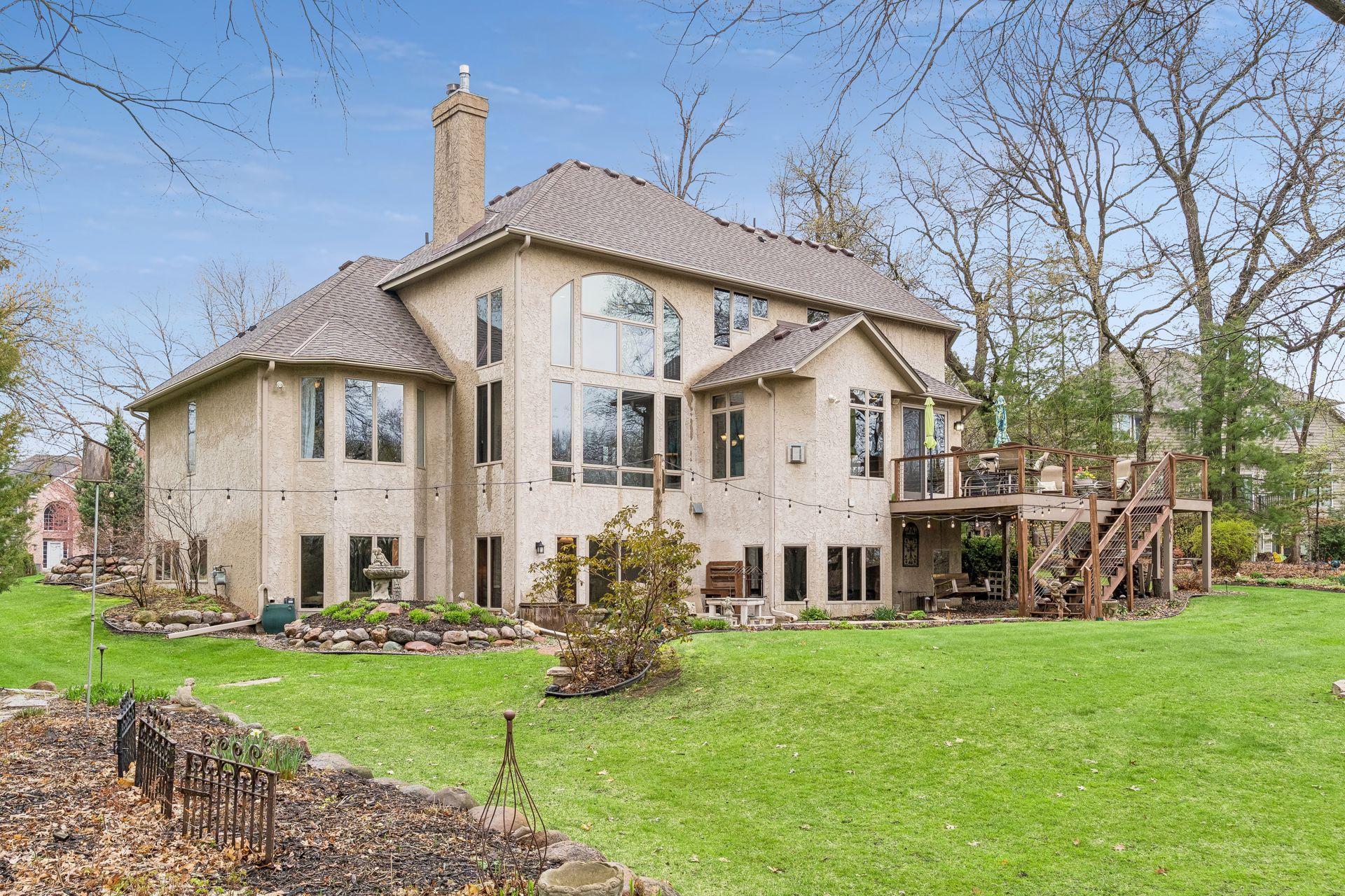 Gorgeous backyard with a large paver patio and open air deck for entertaining.