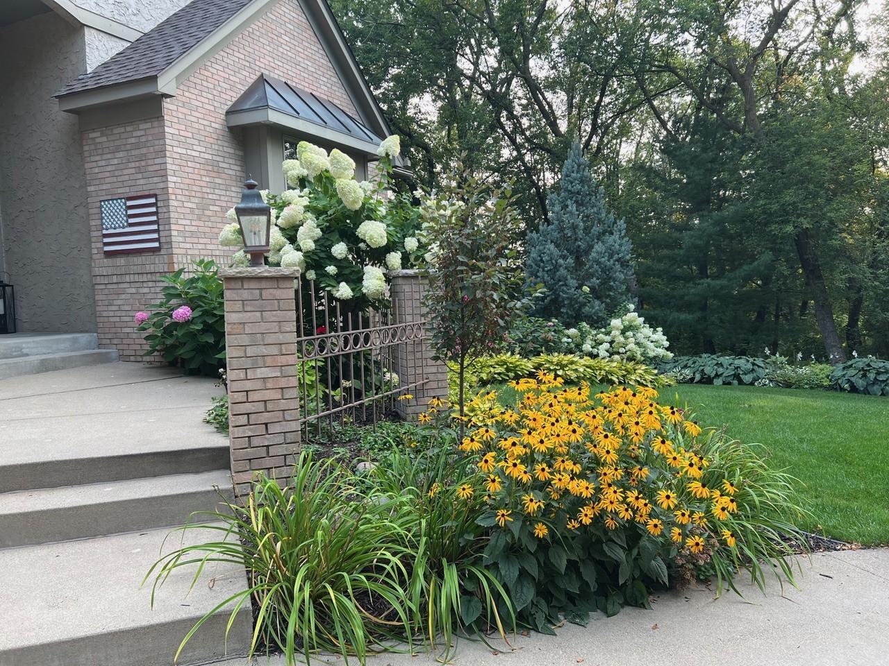 Stunning curb appeal with an elegant angled front elevation, dramatic roof lines, full brick face and oversized garage.