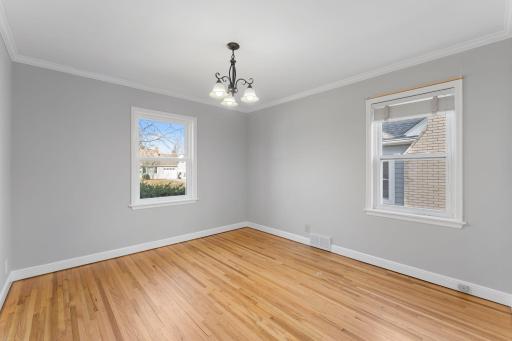 Second bedroom on the main level also has beautiful hardwood floors.