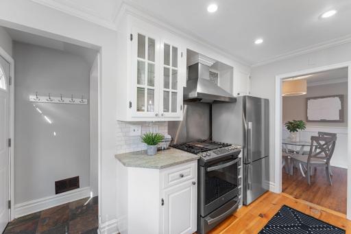 Door conveniently enters from the garage into the kitchen. Newer stove and dishwasher.