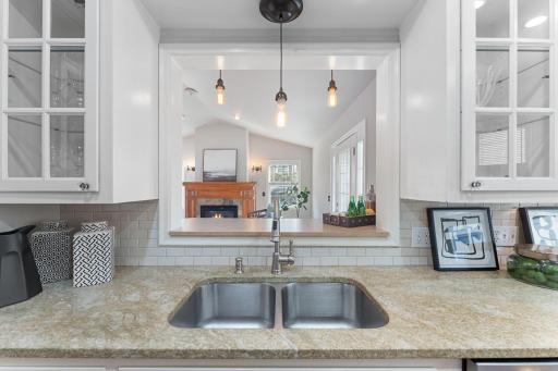 Stay involved with family activities from the kitchen. The opening provides a breakfast counter for casual dining.
