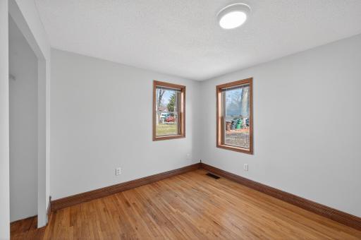 Beautiful Hardwood Flooring in the bedroom.