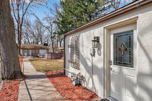 Sidewalk which leads back to your great garage and Private back Yard!!