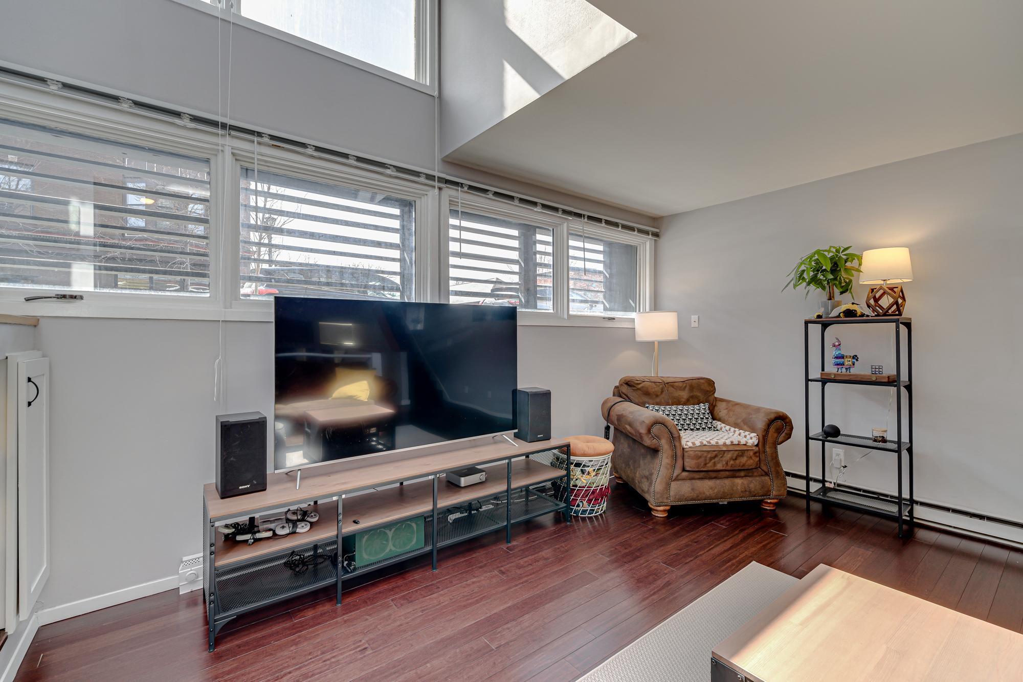Ceiling opens all the way to the lofted bedroom on the upper level