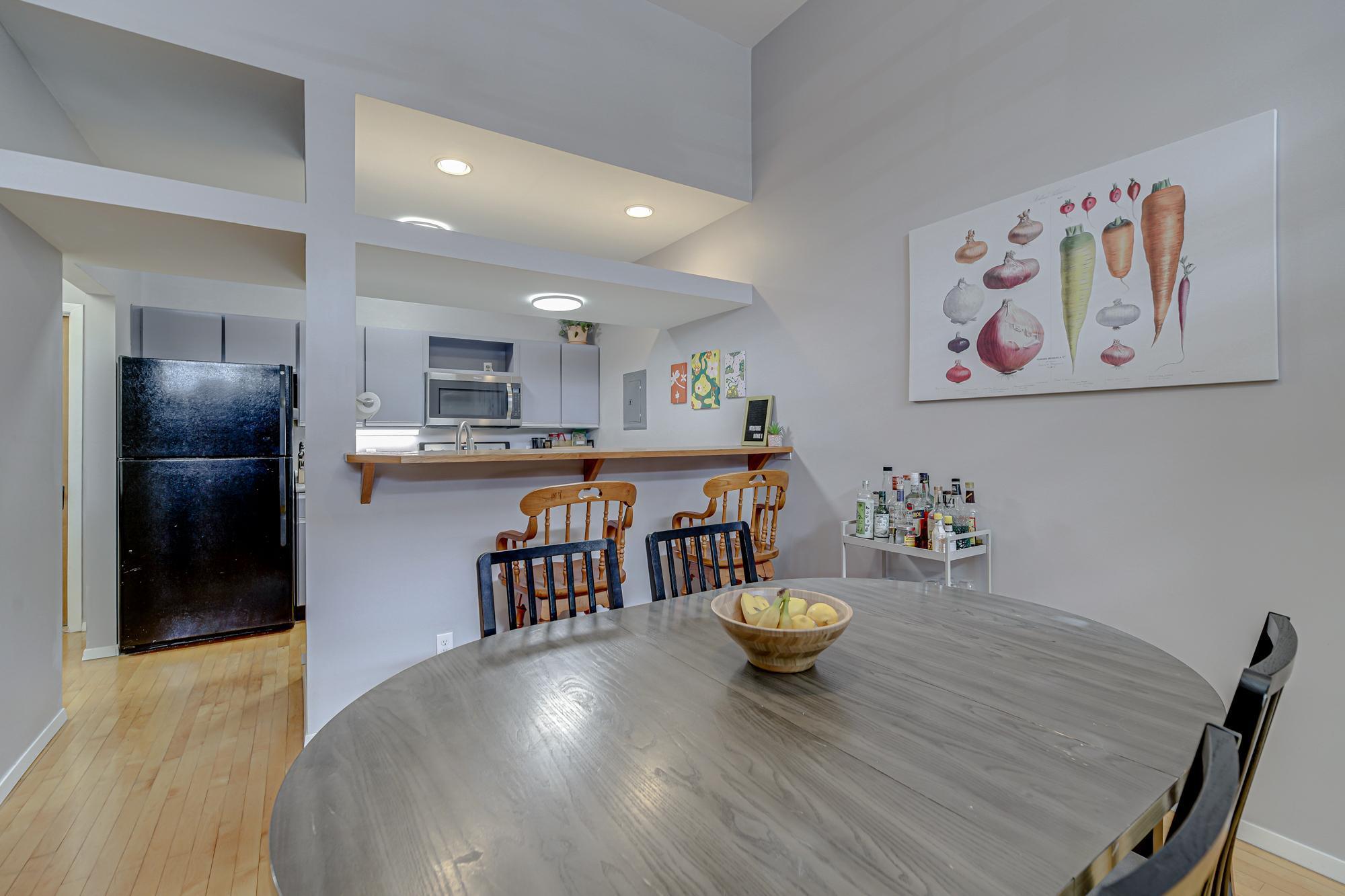 Open space above the kitchen can be useful storage or a place to display plants or decor