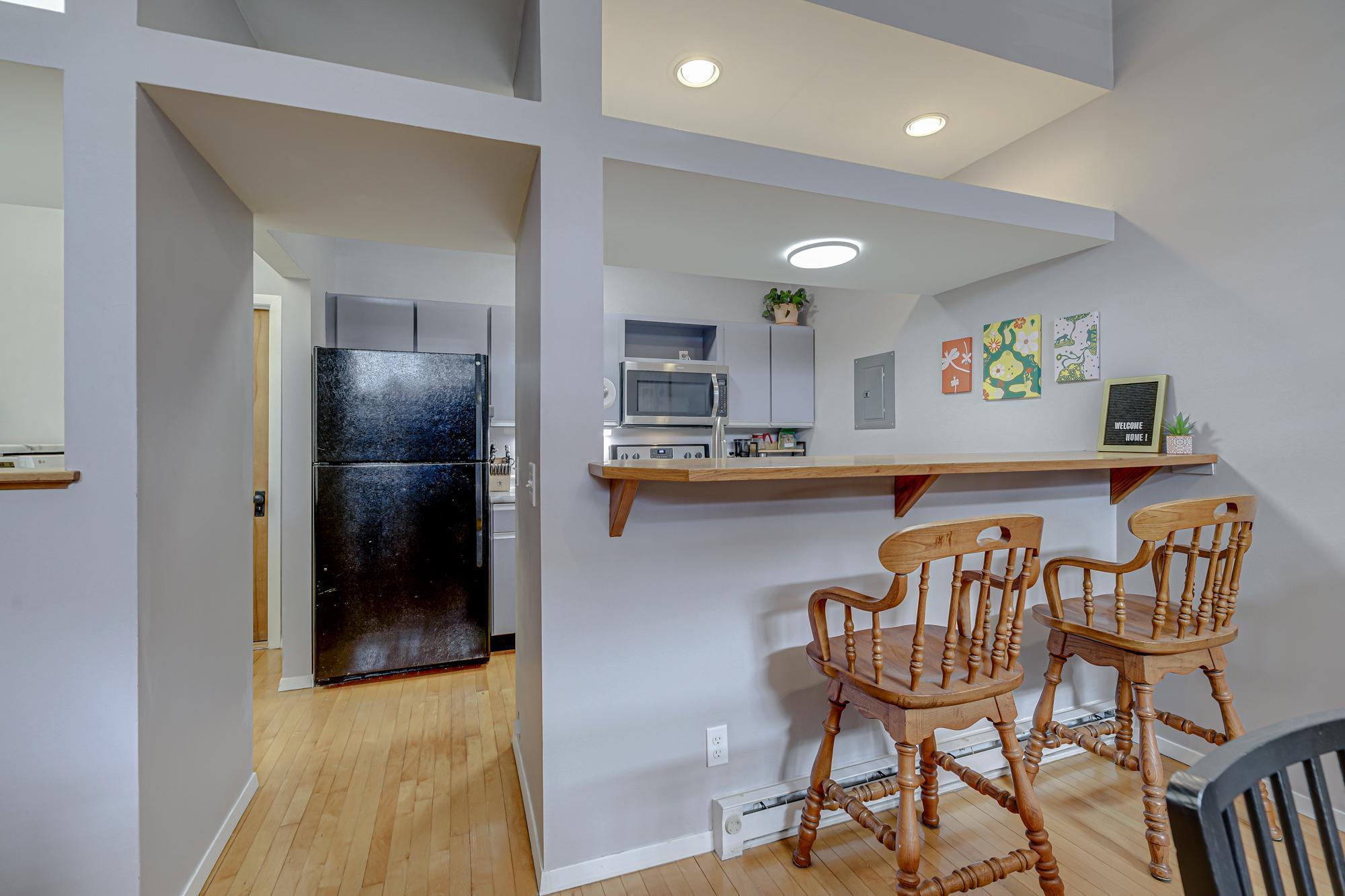Hardwood floors continue into the kitchen