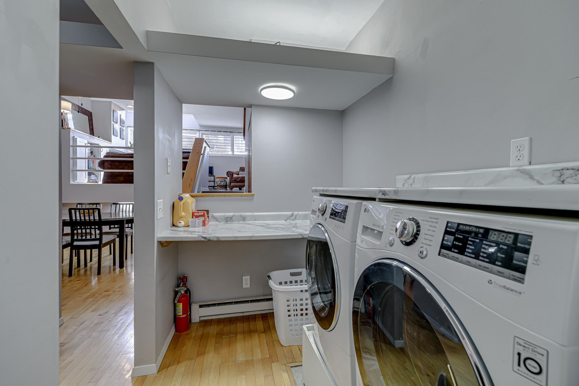 In unit, full size laundry with designated folding counter