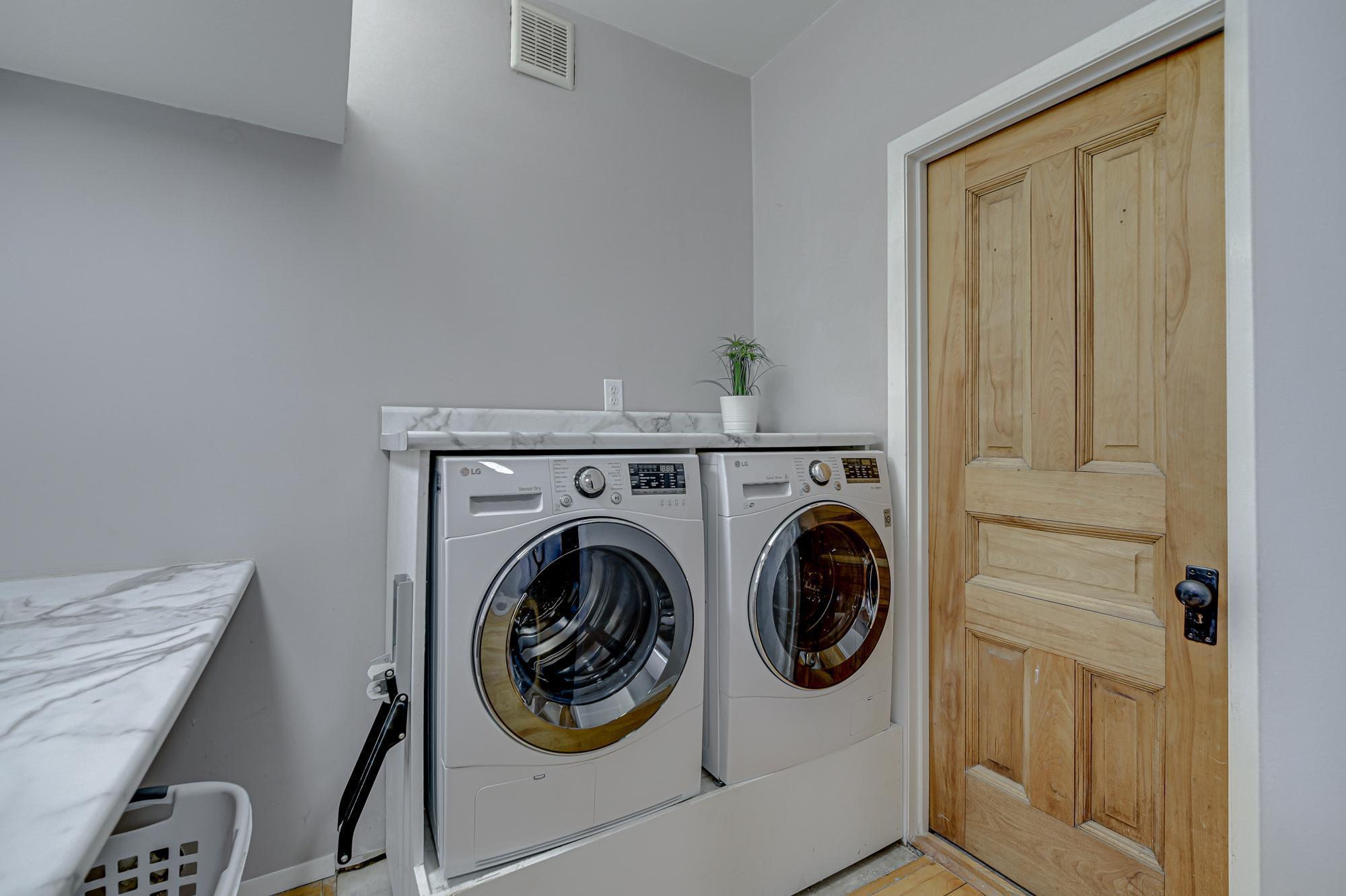 Through the laundry is a closed off storage room