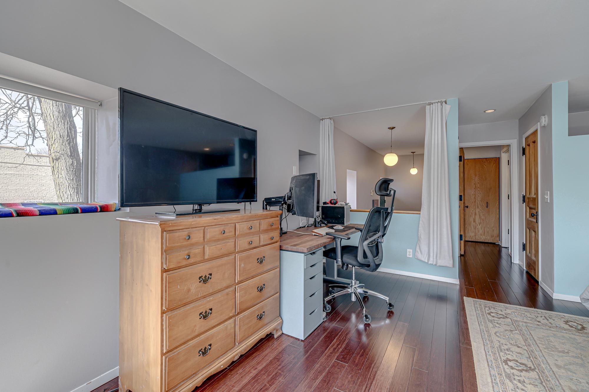 Hallway to walk in closet and full bathroom