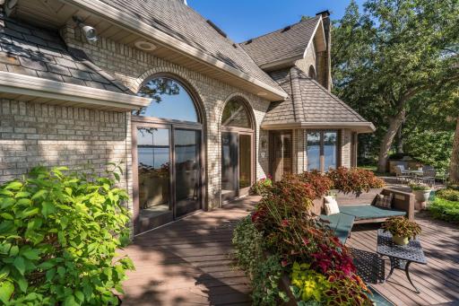 Deck with Shrubs,Parennials flower boxes 2 sliders for entrance to deck and lakeside. (50 Year class 4 roofing for years of protection from wind and storm.