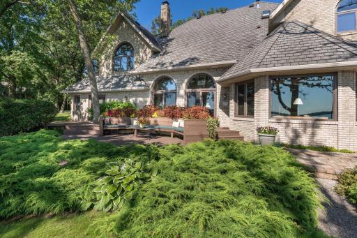Lakeside view of this beautiful all brick Clarence Lang home.