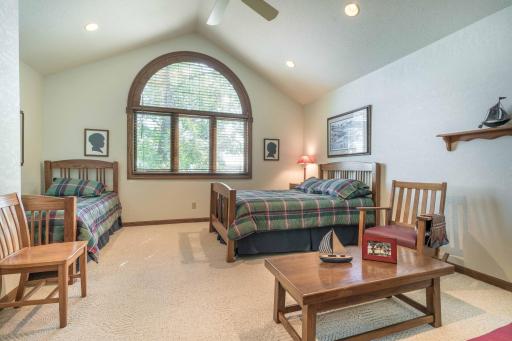 large upper level bedroom suite complete with its own 3/4 Bathroom custom windows.