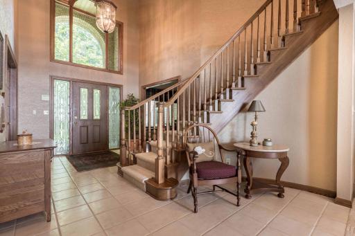 Large foyer entrance and amazing oak curved staircase
