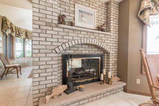 Floor to ceiling Brick natural gas fire place in family room and eat in Kitchen.