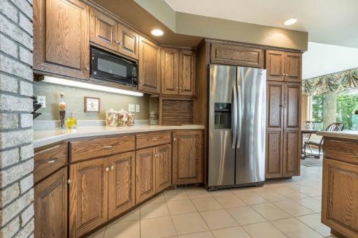lots of Cabinetry and stainless steel appliances.
looking to the eat in kitchen.