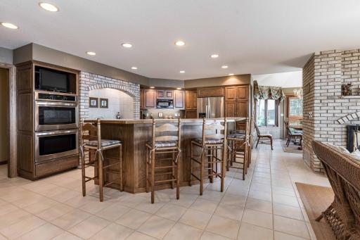 Beautiful Large Kitchen with Brick Alcove complete with exhaust fan above cook top 2 Level counter around the center island.
greatfor entertainment with all guests.
