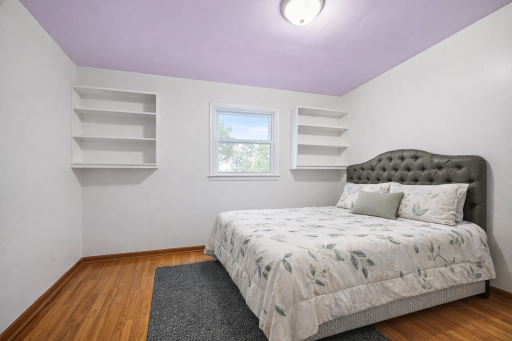 Light filled bedroom with hardwood floors,built ins.