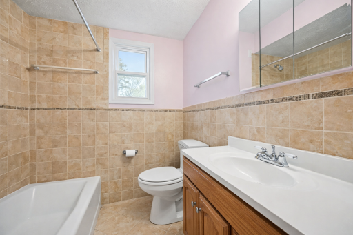 Updated bathrooom with tile surround and natural light.