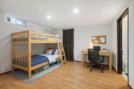Lower-level non-conforming bedroom with flexible use as office or guest space.
