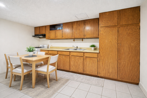 Versatile lower level featuring a second kitchen-ideal for extended living arrangements.