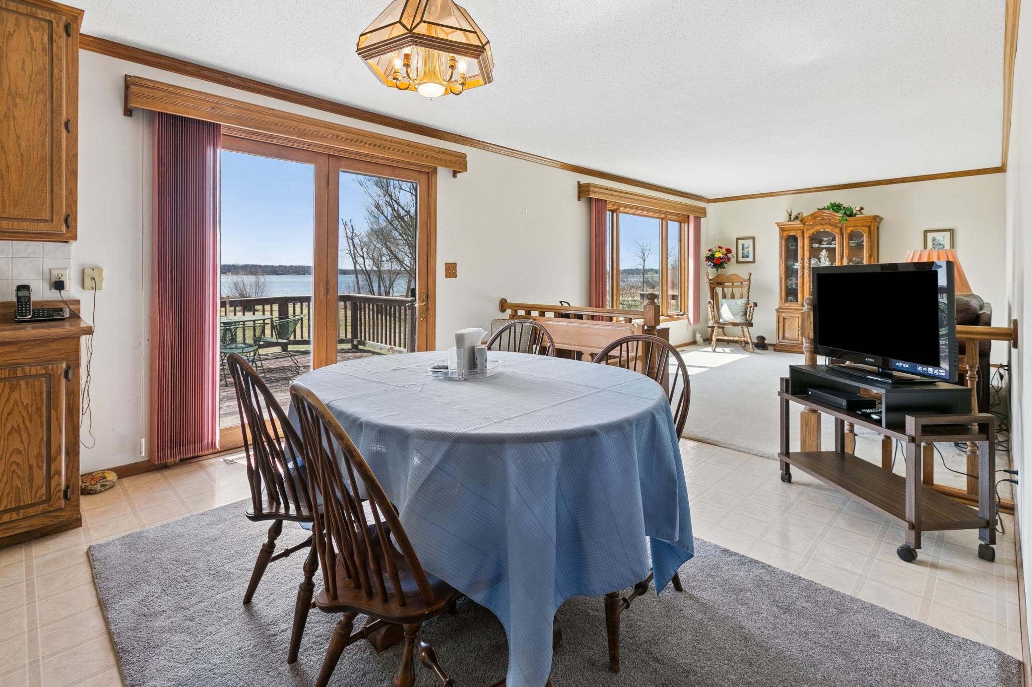 The deck expands the full length of the home and wraps around to the side kitchen entrance. A great place to enjoy your summertime meals.